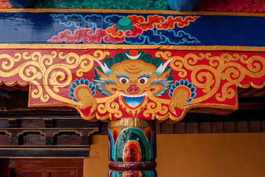 Painted wood carving with guardian dragon at a Buddhist temple