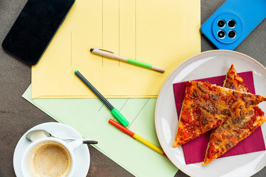 Business lunch break essentials with pizza and coffee