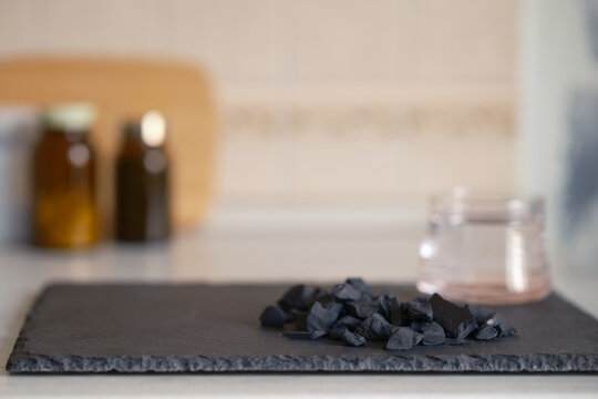 natural black shungite stones used for traditional water filtration,  projects focused on water quality, ecology, and sustainable living.