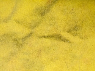 Soft Yellow Fabric Texture with Gentle Wrinkles Providing a Bright Background for Creative Design Projects © NizuCaCi