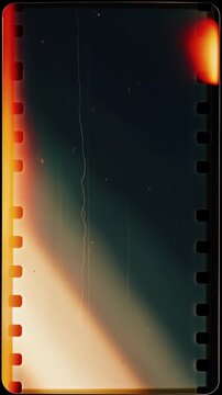 Vintage Super 8 film texture with warm organic light leaks, film burns, moving dust and vertical scratches on retro 8mm frame border in seamless looping abstract sequence ideal for creative video over