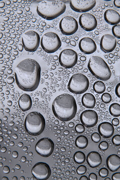 Black and white water droplet pattern inside a glass bottle