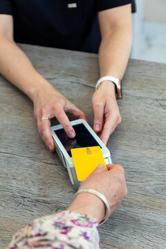 Contactless card payment at beauty center reception desk