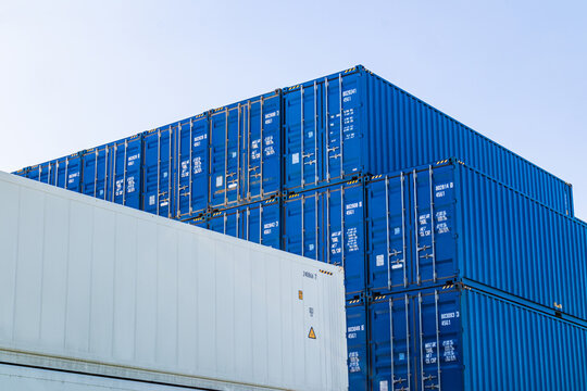 Stacked blue shipping container at port