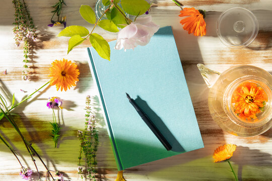 Mindful journaling with herbal tea and garden flowers