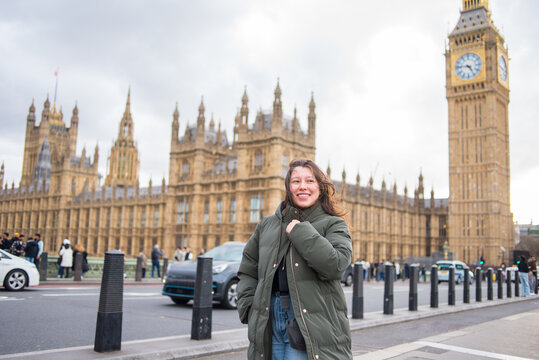 Smiling woman exploring London on a winter day