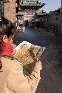 Exploring Pingyao's traditional streets with a map