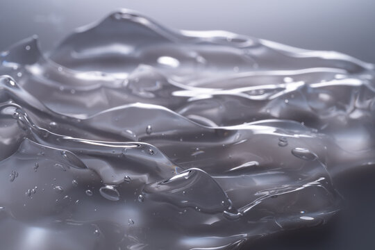 Macro view of translucent gel texture with light reflections