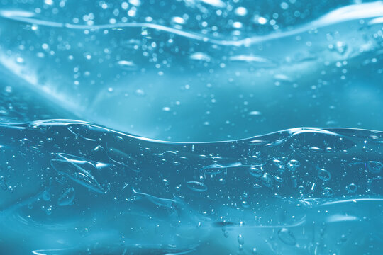 Clear blue gel texture with bubbles in macro view