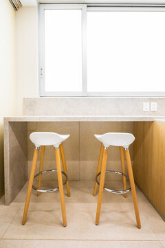 Minimal kitchen breakfast bar with two modern stools