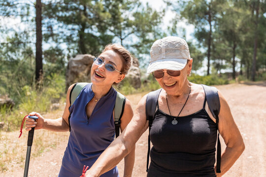 Mature women enjoying a joyful mountain hike