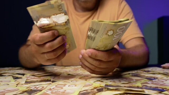 Counting and handling Canadian dollars in a vibrant setting