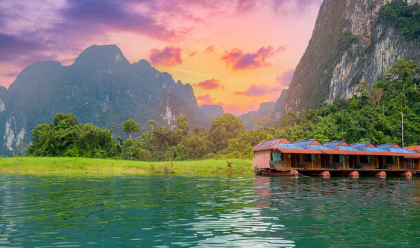 Aerial view of khao sok national park at sunset with floating houses, thailand