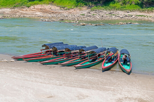 Boats in the Usumacinta river for transport to Yaxchilan maya ruins, Mexico - Guatemala border.