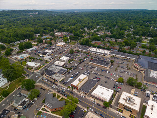 Obraz premium Aerial view of suburban town center with parking lots and shops