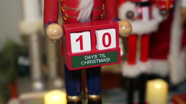 10 Days till Christmas counter held by nutcracker
