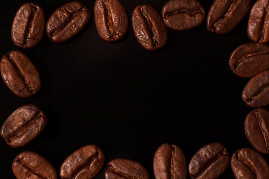 Coffee beans frame on dark background with space for text caffeine background espresso