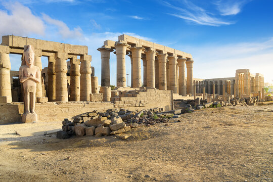 The Colonnade of Amenhotep III with it's 14 column gallery of papyrus pillars, and the Peristyle Sun Court in the distance at the ancient Luxor Temple, Luxor, Egypt.