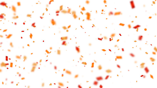 Festive red and orange confetti falling against a white background with blurred bokeh effect