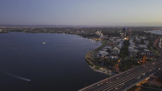 Aerial drone view of Swan River and Perth cityscape at sunset, Western Australia