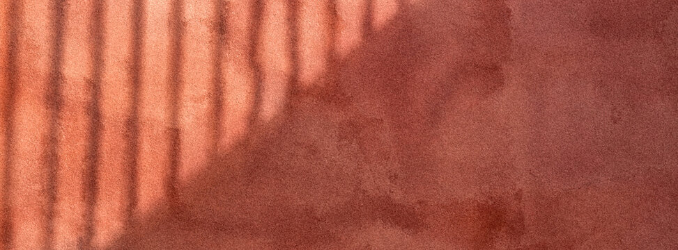Close-up of textured, warm-toned surface with subtle shadows and lines creating an abstract design. Suitable for backgrounds and artistic compositions.