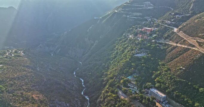 Tolantongo Mexico Aerial v1 drone fly around hidden remote canyon mountains, secluded hot springs resorts town capturing beautiful natural landscape - Shot with Mavic 3 Cine - December 2021