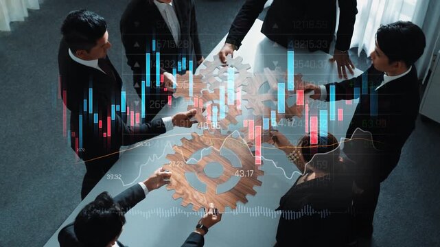 Professionals engage in strategic discussion with gears and financial graphs in a modern office, symbolizing teamwork and innovation for business growth and success. Raster
