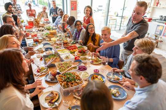 Diverse group enjoying communal meal