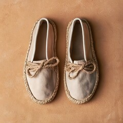 Canvas Espadrille Shoes Flat Lay on Sandy Tan Background © Tharshan