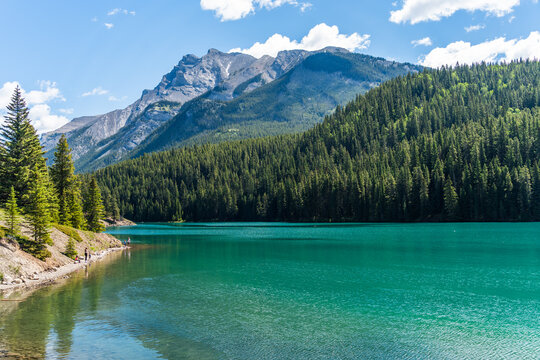 Family Fishing on the Bank of Two Jack Lake in Banff National Park, Alberta, Canada