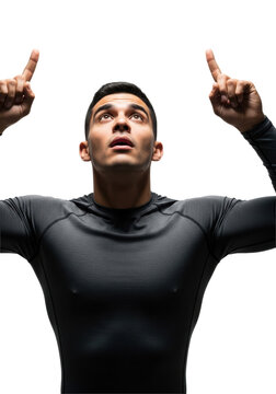 young handsome hispanic male in textural dark gray sportswear, gazing upward, hands raised with extended fingers, dramatic lighting against white background. concept of sudden awe and wonder