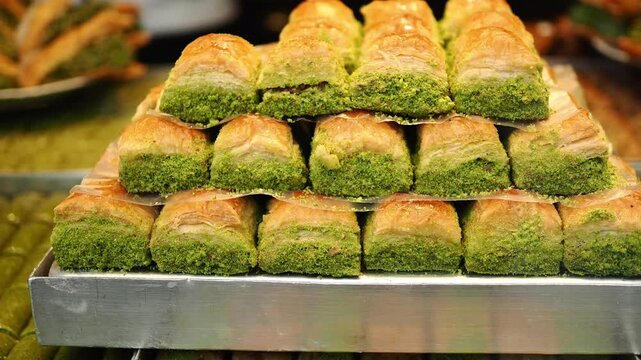 Delightful baklava tower in vibrant market setting