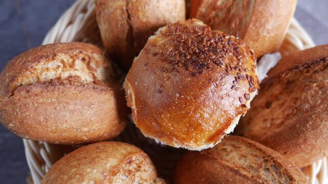 Delightful bread rolls showcased in a cozy bakery basket