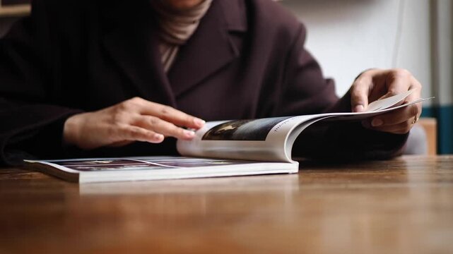 Turning pages of a cafe menu