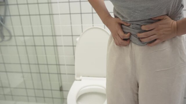 stomach ache. Asian women have abdominal pain, indigestion, gastritis, menstrual cramps, flatulence, diarrhea, distention, colon cancer, belly inflammation problem, suffer food poisoning, abdomen