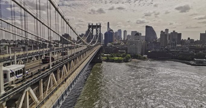 NYC New York Aerial v409 low drone flyover East river along Manhattan bridge towards Dumbo capturing riverfront park and Brooklyn downtown cityscape - Shot with Mavic 3 Pro Cine - September 2023