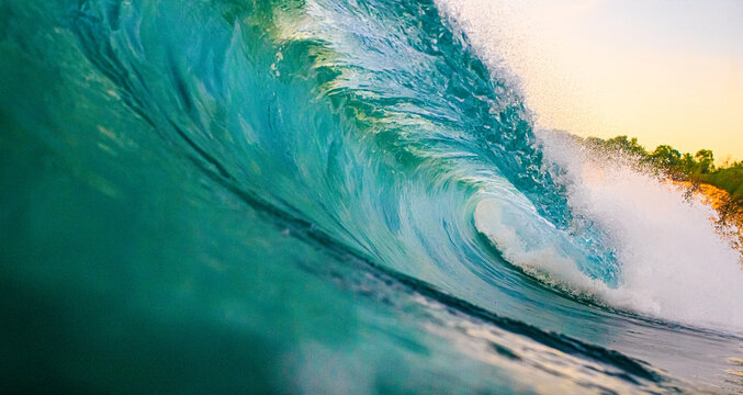 Powerful Turquoise Ocean Wave Curling with Golden Sunset Light