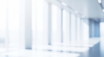 Fototapeta premium Abstract blurred office hallway with bright natural light coming from glass windows