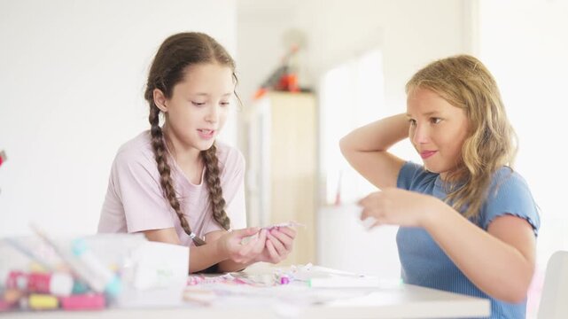 Group of Diverse school children creating arts and crafts together during creative classroom activity developing imagination teamwork fine motor skills and hands on learning in elementary education
