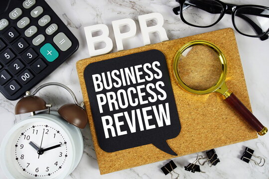 BPR - Business Process Review acronym with calculator, alarm clock and magnifying glass, Business concept