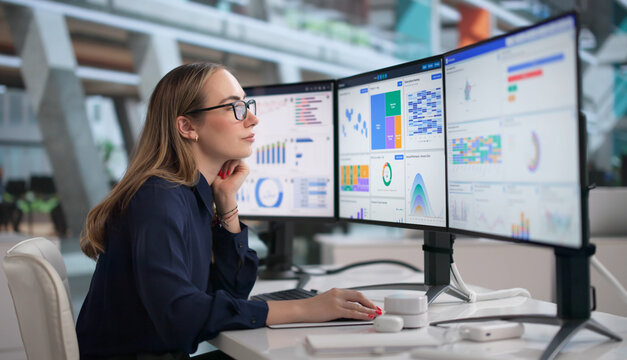 Young Financial Analyst Reviews Business Data