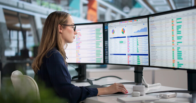 Young Woman In Medical Office Analyzing Billing Data