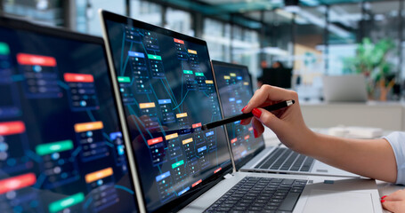 Naklejka premium Young Business Analyst Studies Automated Workflow