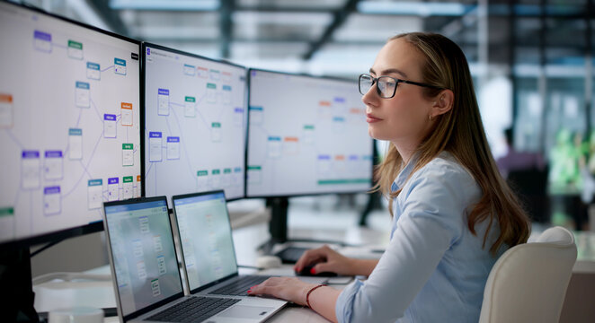Young Business Analyst Uses Laptop