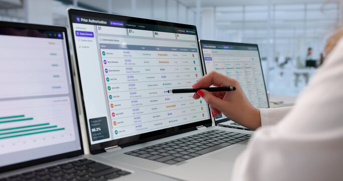 Healthcare Manager Woman Reviews Multiple Prior Authorization Requests
