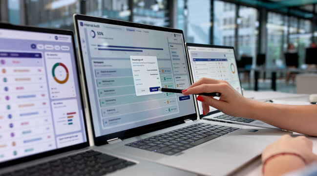 Young Woman Reviews Software Dashboard Data