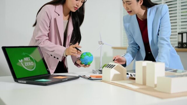 Business team working virtual modern smartphone to reduce CO2 emissions carbon footprint climate change to limit global warming.Sustainable development