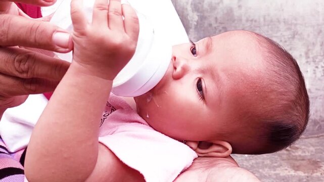 Infant formula serves as a supplement to breast milk, ensuring the baby receives necessary macro- and micronutrients. Care should be taken when feeding it to a sleepy baby, as this can lead to choking