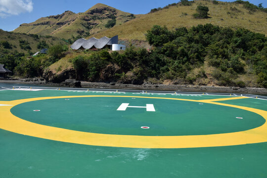 A helipad on the shore of Gili Mori, Labuan Bajo, East Nusa Tenggara, Indonesia, with bright colors and the letter H symbol