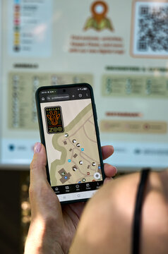 Smartphone Displaying Dallas Zoo Map in User's Hand Outdoors